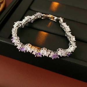 Detailed shot of zircon twisted bracelet with purple and white round gemstones