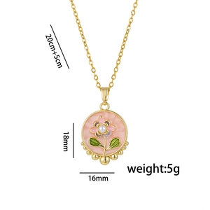 Pink enamel flower pendant necklace in gold-plated copper with pearl detail and sizing info