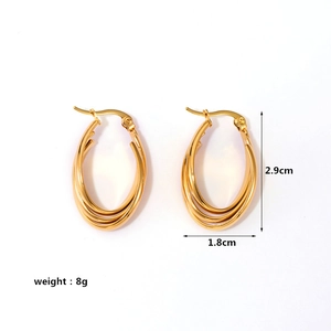 Detail view of gold croissant earrings with size dimensions 2.9cm x 1.8cm and 8g weight