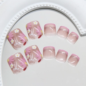 Purple daisy and white bow press-on toenails with French tips for a stylish pedicure