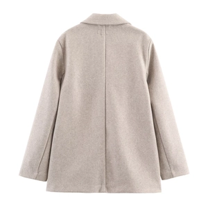 Back view of oatmeal colored soft wool blazer for women with a minimalist silhouette