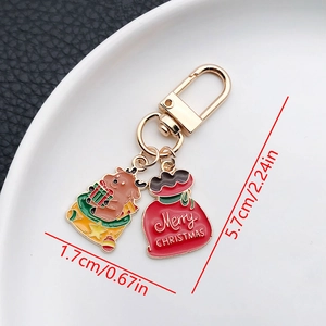Detail view of Christmas keychain showing reindeer pendant and 5.7cm total length