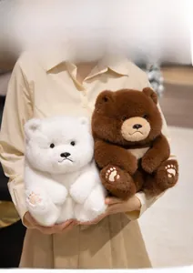 Detail of plush teddy bear showing high-quality fur texture and soft pink paw embroidery