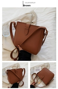 Close-up of a brown matte faux leather bucket bag with adjustable strap and buckle details