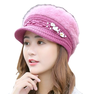 Winter pink knit visor beanie for women featuring faux fur top and pearl flower detail