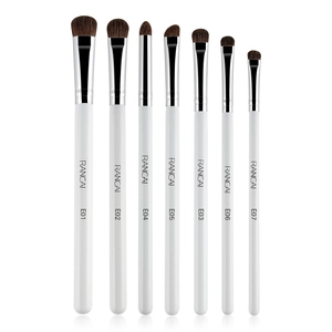 Detailed macro view of horse hair eyeshadow brushes with white handles and silver ferrules