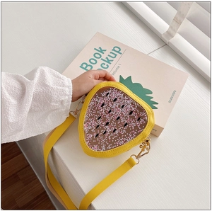 Detail of yellow strawberry jelly bag for kids with pink star sequins and PVC window