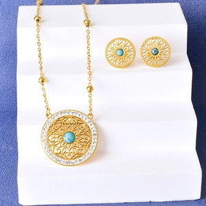 Vintage gold hollow necklace and stud earrings set with turquoise and sparkling zircon stones