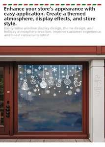 Detailed view of white snowflake and star static decals on a glass window pane