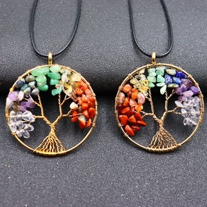 Handmade golden Tree of Life necklace featuring colorful chakra natural stone pendants