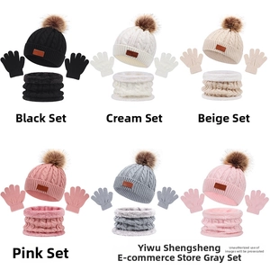 Multi-color collection of knitted winter hats with pom-poms, scarves and glove sets