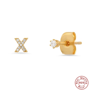 Detail of S925 sterling silver gold letter X earring and stud with sparkling zircons