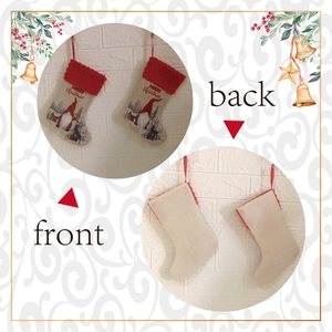 Detailed front and back view of fabric Christmas stockings with Santa and reindeer motifs