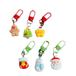 Christmas keychain set with gingerbread man and santa claus motifs on white background