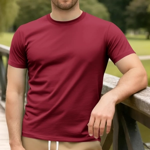 Men's burgundy cotton crewneck short sleeve T-shirt shown on model in outdoor park setting