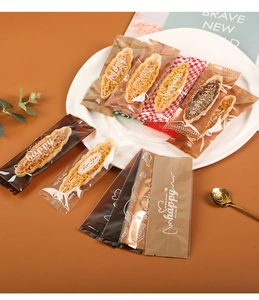 Flat lay of colorful cookie packaging bags with elegant gold and checkered patterns
