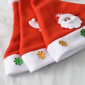 Three red plush LED Christmas hats with cartoon Santa Claus and shiny gold snowflakes
