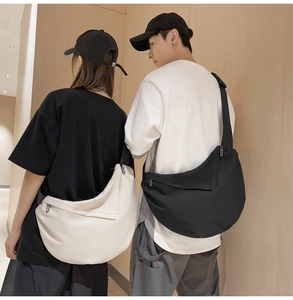 Minimalist crossbody dumpling bag showing black and beige options worn by models