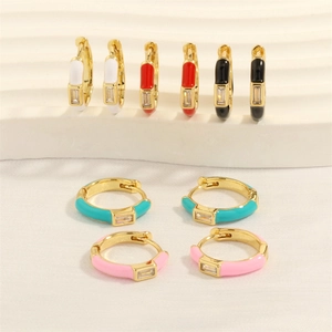 Detailed view of colorful enamel hoop earrings with rectangular zircon in gold finish
