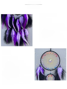 Detailed view of handmade dreamcatcher featuring black feathers and woven crystal moon pendant