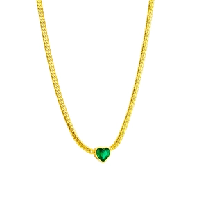 Elegant gold snake chain necklace with a sparkling heart-shaped green gemstone pendant