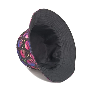 Detailed view of colorful skull print and black interior lining on the bucket hat