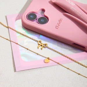Elegant gold-plated stainless steel necklace set with bow and heart pendants for women
