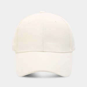 Detailed macro view of the cream cotton twill baseball cap with six-panel design and eyelets