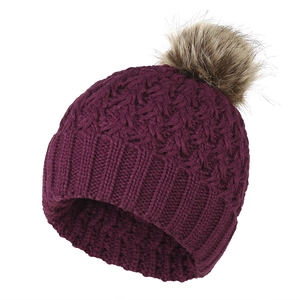 Close-up of deep purple knit texture and brown faux fur pompom on winter ski hat