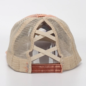 Detail of cross elastic bands on mesh ponytail baseball cap with adjustable strap