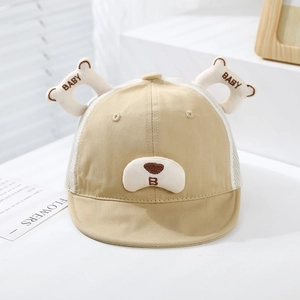 Detail of baby sun hat featuring breathable white mesh back and cute bear ear embroidery