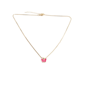 Detail showing the pink enamel butterfly pendant on a gold chain with a white background