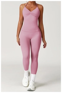 Pink high-stretch yoga set featuring backless halter top and tight high-waist leggings