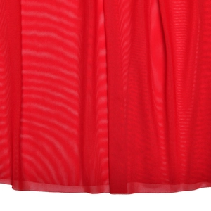 Close-up of elegant red tulle fabric with detailed pleats on a strapless evening gown