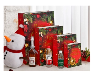 Detail of red Christmas gift bags with gold foil patterns and size comparison references