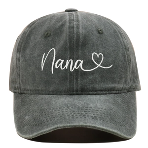 Close-up of Nana embroidery and heart detail on washed charcoal cotton baseball cap