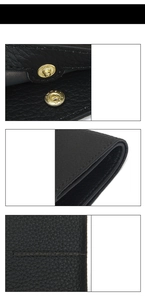 Detailed macro view of black top grain leather texture with stitching and metal snap button