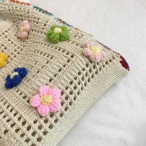 Handmade woven tote bag with 3D crochet flowers for summer beach vacations