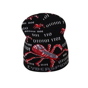 Kids black cyberpunk knitted beanie featuring a red spider pattern and binary code
