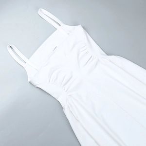 Detailed view of waist pleats and double straps on white sleeveless A-line maxi dress