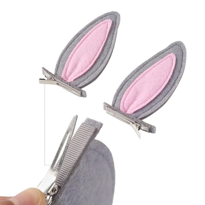 Detail view of gray and pink bunny ear hair clips with durable metal alligator grips