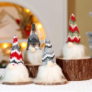 Close-up of four festive Christmas gnomes with knitted hats and faux fur details