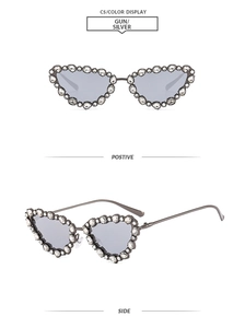 Macro view of gun-silver metal cat-eye sunglasses frames with hand-set crystal rhinestones