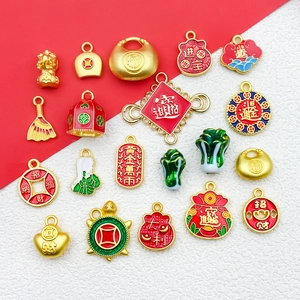 Close-up of gold Chinese lucky charms including sycee and fortune coins for DIY jewelry