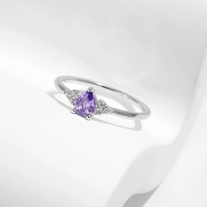 Elegant S925 silver ring featuring a teardrop purple amethyst on white geometric stands