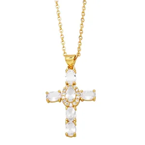 Elegant gold cross pendant necklace featuring oval white zircons and a fine chain