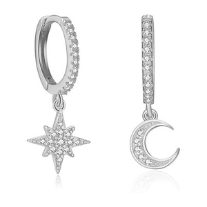 Macro shot of silver plated star and moon drop earrings with micro paved cubic zirconia