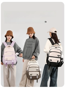 Three students style backpacks in purple, brown and black with cloud charm pendants