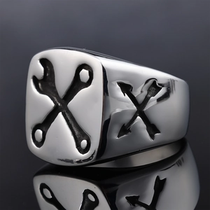Mens silver stainless steel signet ring with engraved wrench and arrow industrial design