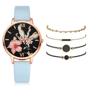 5-piece set with rose gold floral quartz watch and minimalist bracelets on white background